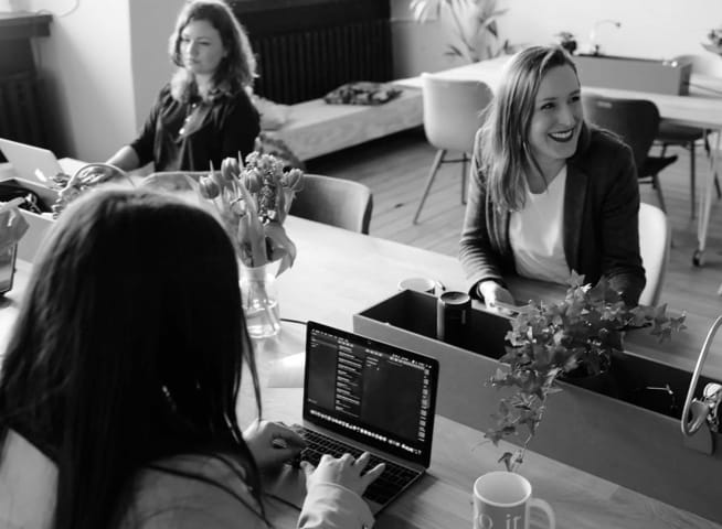 A picture of three women in an office